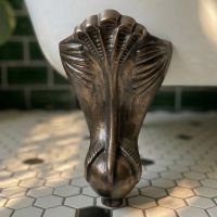 Digital Illustration of the Bronze Claw Bath Feet Mounted on a White Bath in a Bathroom Scene