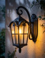 Digital Illustration of the Bronze Version of the Traditional "Giovanna" Top Fix Outdoor Wall Lantern Lit up at Night