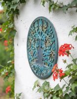 Digital Illustration of the Buddha and The Tree of Life Mirrored Garden Wall Art Mounted on a White Garden Wall Viewed from an Angle