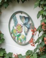 Digital Illustration of the Butterfly and Flowers Silhouette Garden Wall Art Angled View on a Garage Wall