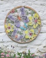 Digital Illustration of the Colourful Butterfly Garden Wall Art on a Rustic White Wall Building