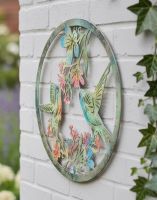 Digital Illustration of the Colourful Hummingbird Garden Wall Art Displayed on a White Brick Building Wall