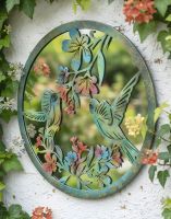 Digital Illustration of the Colourful Hummingbird Mirror Garden Wall Art Mounted on the Side of a White Garden Building
