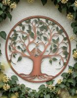 Digital Illustration of the Green & Rustic "Love Birds" Wall Art Positioned on a White Building Wall Surrounded by Wall Plants