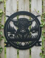 Digital Illustration of the Highland Cow Profile Garden Wall Art Mounted on a Garden Fence