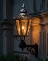 Digital Illustration of the Large Polished Nickel Concordia Hexagonal Lantern On a Royale Bracket Lit up at Night