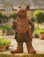 Digital Illustration of the Large Rustic Cast Iron Mouse Sculpture on a Garden Wall with a Country House in the Background Digital Illustration of the Large Rustic Cast Iron Mouse Sculpture on a Garden Wall with a Country House in the Background