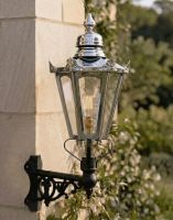 Digital Illustration of the Medium Polished Nickel Concordia Hexagonal Lantern On a Corner Bracket Mounted on a Sandstone Brick Building Wall