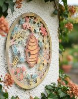 Digital Illustration of the Rustic Bee Hive Garden Wall Art Front on View on the Edge of a White Garden Wall