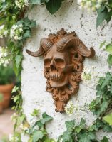 Digital Illustration of the Rustic Cast Iron "El Diablo" Exterior Wall Art Mounted on a White Exterior Wall Viewed from an Angle