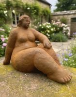 Digital Illustration of the Rustic Cast Iron "Arabella" Sculpture Positioned on a Garden Wall in Front of a Cottage