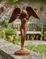 Digital Illustration of the Rustic Cast Iron Free Standing Winged Angel Sculpture on a Garden Wall with a Rustic Stone Garden Wall in the Background