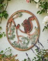 Digital Illustration of the Rustic Squirrel Garden Wall Art Mounted on a Cream Wall in a Garden Viewed from an Angle Digital Illustration of the Rustic Squirrel Garden Wall Art Mounted on a Cream Wall in a Garden Viewed from an Angle