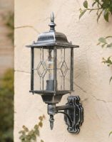 Digital Illustration of the Silver "Marsden" Wall Lantern Mounted on a Rustic White Garden Wall
