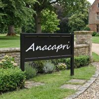 Digital Illustration of the Standing Steel House Name Sign Positioned at an Entrance Driveway to a House Digital Illustration of the Standing Steel House Name Sign Positioned at an Entrance Driveway to a House