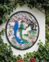 Digital Illustration of the Steel Cherry Blossom and Birds Garden Wall Art Mounted on a White Garden Wall