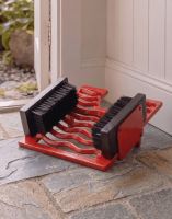 Digital Illustration of the Three in One Red Boot Jack Boot Brush and Scraper on a Stone Cottage Hallway