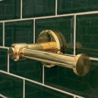 Digital Illustration of the Brass Version of the Toilet Roll Holder Button End Without a Toilet Roll Seen Close up