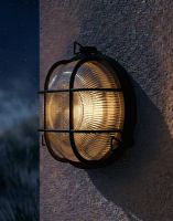 Digital Illustration of the Traditional Nautical Round "Danby" Bulkhead Wall Light in a Black Finish Lit up at Night
