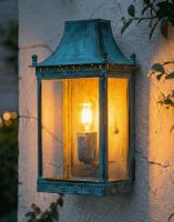 Digital Illustration of the Verdigris Finished "Henlow" Traditional Wall Lantern Lit up at Night