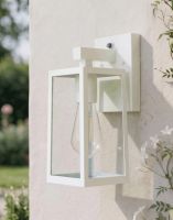 Digital Illustration of the White Version of the Davenport Garden Wall Light Fixed to a White Garden Wall with Flowers in Foreground 