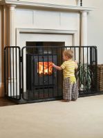 Digital illustration of Traditional Large Black Nursery Fire Guard with toddler stood in front of it