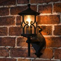 digital representation of "Ebberton" Scrolled Design Traditional Bottom Fix Wall Lantern lit up at night