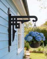 Digital representation of Art Deco Heavy Duty Iron Hanging Basket Bracket mounted on a shed