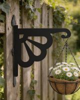Digital representation of Clam Design Heavy Duty Iron Hanging Basket Bracket mounted on a fence