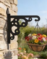 Digital representation of Ornate Heavy Duty Iron Hanging Basket Bracket mounted on a cottage