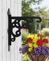 Digital representation of Ornate Heavy Duty Iron Hanging Basket Bracket mounted on a summerhouse