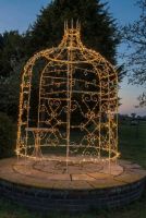 Digital representation of "Rapunzel" Cream Tower Top Gazebo lit up at night