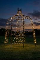 Digital representation of "Rapunzel" Tower Top Black Gazebo lit up at night