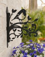 Digital Illustration of the Robin & Branches Iron Hanging Basket Bracket Mounted on a White Brick Wall