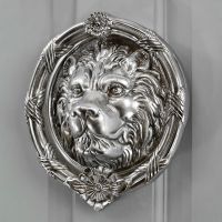 Bright Chrome Sandringham door knocker on grey door Bright Chrome Sandringham door knocker on grey door