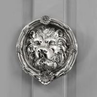 Bright Chrome Sandringham door knocker on grey door Bright Chrome Sandringham door knocker on grey door