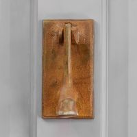 Rustic welly door knocker on front door