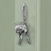 Bright Chrome Fox Door Knocker on Green door Bright Chrome Fox Door Knocker on Green door