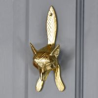Polished Brass Fox door knocker on pastel grey door Polished Brass Fox door knocker on pastel grey door