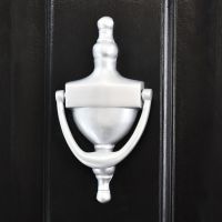 Silver Finish Urn Style Door Knocker on a Black Door