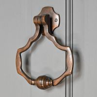 Antique Brass Modern door knocker on grey door Antique Brass Modern door knocker on grey door