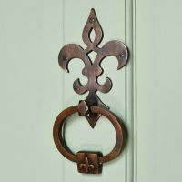 18th century french antique copper door knocker on green door