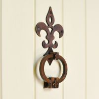 Antique copper Period style door knocker on cream door