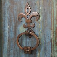 Antique Copper Door Knocker on old wooden door