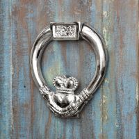 bright Chrome Claddagh Door Knocker on rustic door