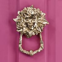 Brass goddess door knocker on front door finished in pink Brass goddess door knocker on front door finished in pink