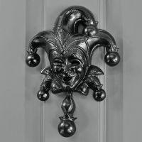 Black Jester door knocker on Grey door Black Jester door knocker on Grey door