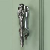 Bright Chrome Running fox door knocker on green door Bright Chrome Running fox door knocker on green door