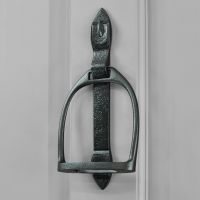 Black Stirrup door knocker on grey door