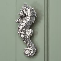 Bright Chrome Sea Horse Door Knocker on pale Green door